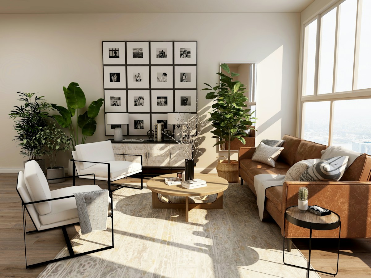 Sunlit contemporary living room with neutral seating, warm wood, and leafy plants.